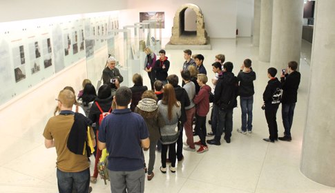 students stand and listen during a museum tour | Equity - the school travel people