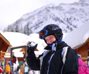 student looking directly at camera holding a snowball | Equity - the school travel people