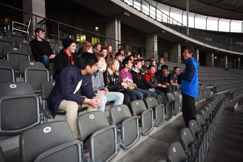 Students enjoying a stadium tour during their trip