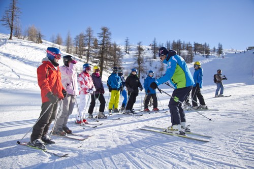 Students enjoying a ski lesson in Claviere, Italy.