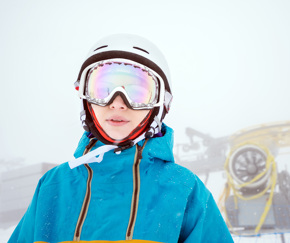 close up of a student wearing ski goggles and a helmet | Equity - the school travel people