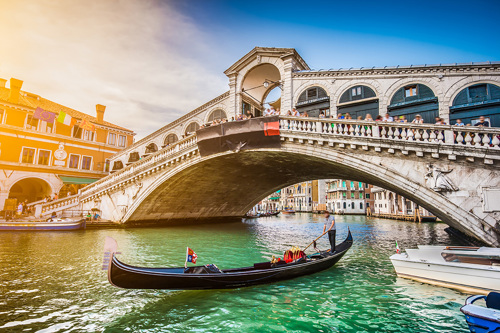 The stunning Rialto Bridge on a sunny day in Venice, Italy.