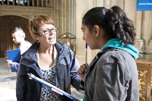 A teacher helping out one of her students