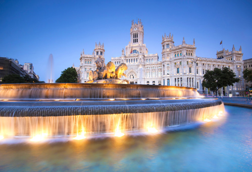 The Royal Palace of Madrid looks brilliant by day or night, thanks to its light building stone, lights, and fountains.