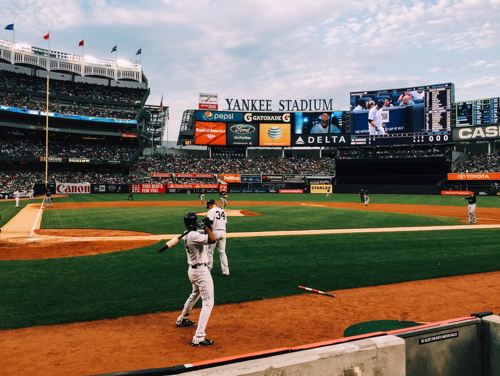 The New York Yankees playing at the Yankee Stadium