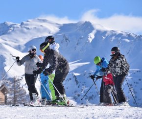 group of skiers resting on italian mountain | Equity - the school travel people