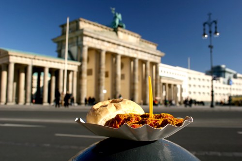 A fresh and delicious Currywurst in front of the Brandenburg Gate.